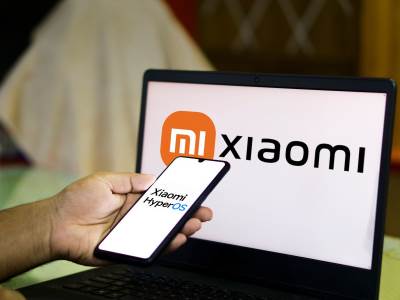 Xiaomi _ telefon _ laptop _ HyperOS _ Foto Shutterstock.jpg Xiaomi _ telefon _ laptop _ HyperOS _ Foto Shutterstock.jpg